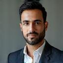 Headshot of Ali Ahmed, a client.